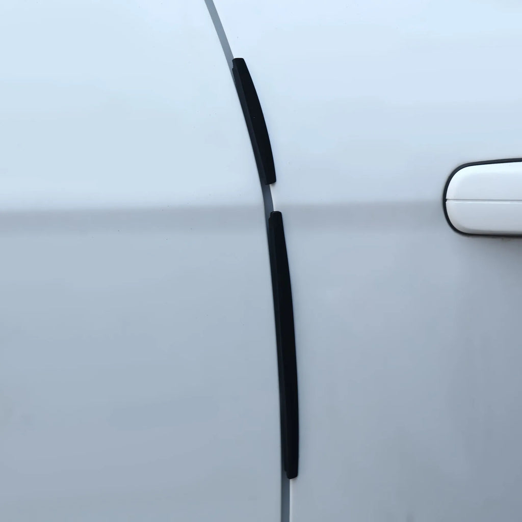 White plastic car door edge protection bumper strip set on a clean background