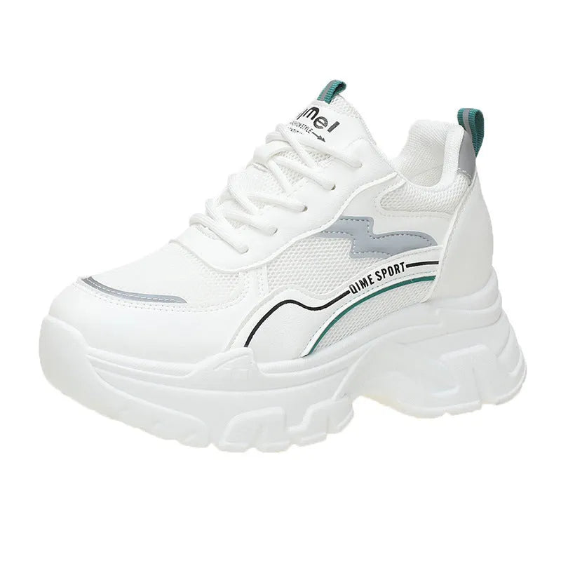 Women's white and beige dad shoes with cross shoulder straps and lace-up front, showing round toe.