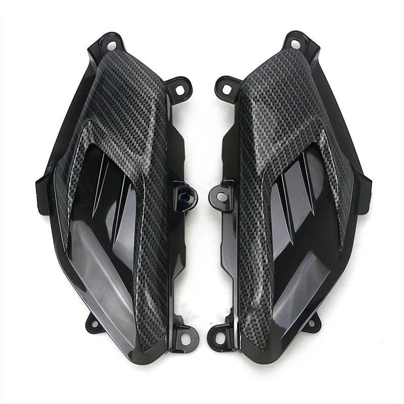 Pair of carbon fibre style LED side lamps for Yamaha NMAX scooter on a white background.