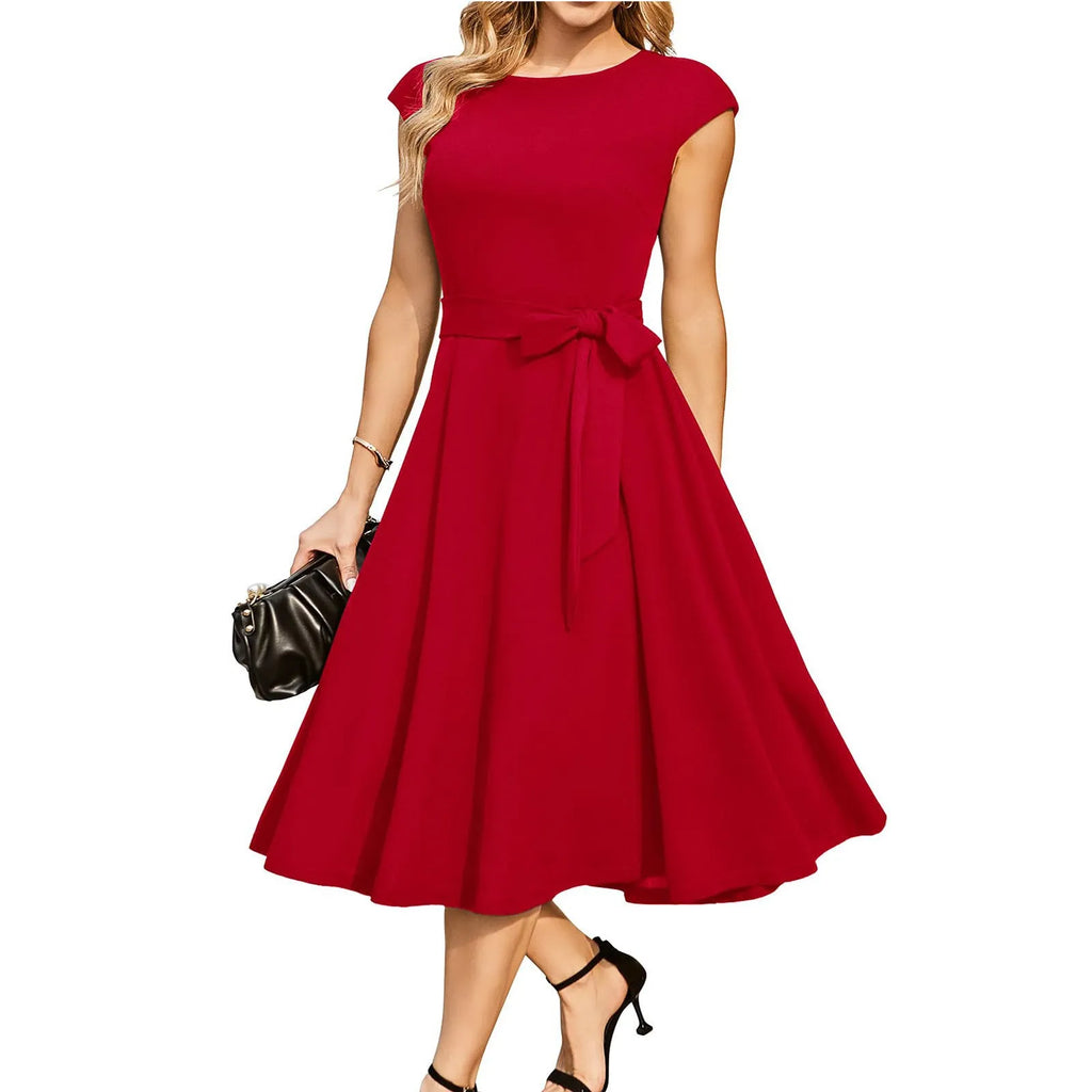 Sleeveless black dress with lace-up mid waist and a flowing swing skirt.