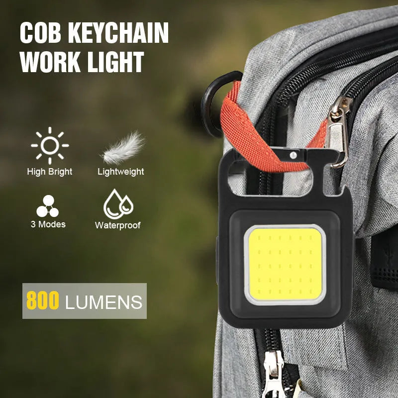 Black aluminium alloy USB keychain light with magnetic base and foldable handle