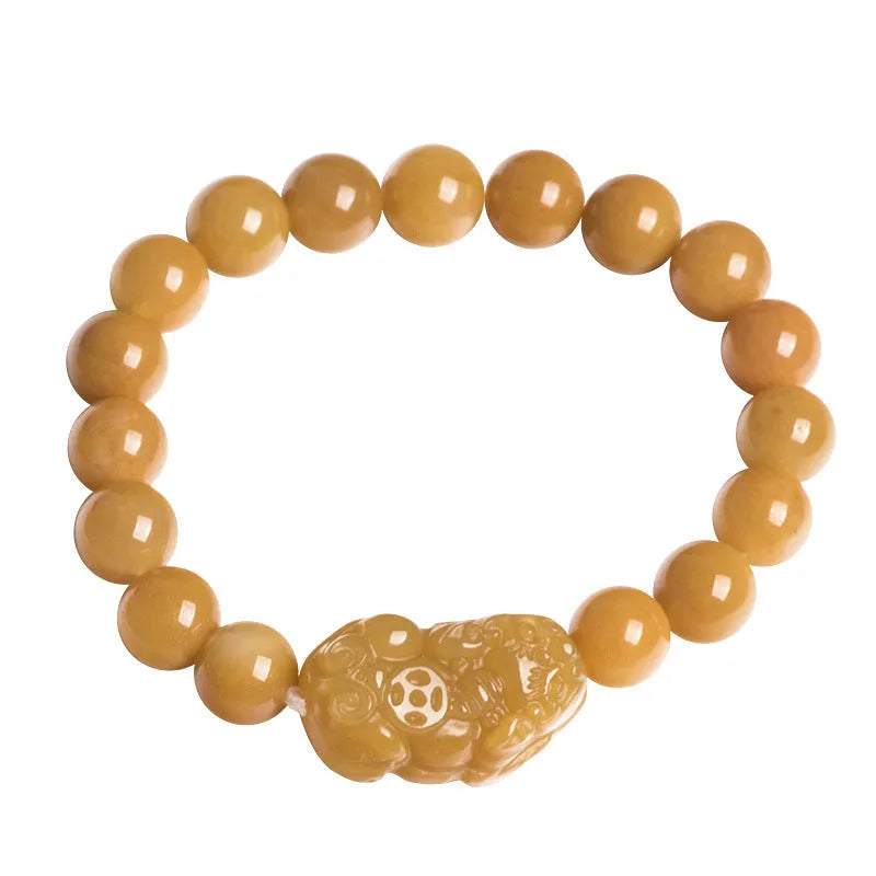 Carved Jinsi jade money bracelet showing golden thread texture and bead details