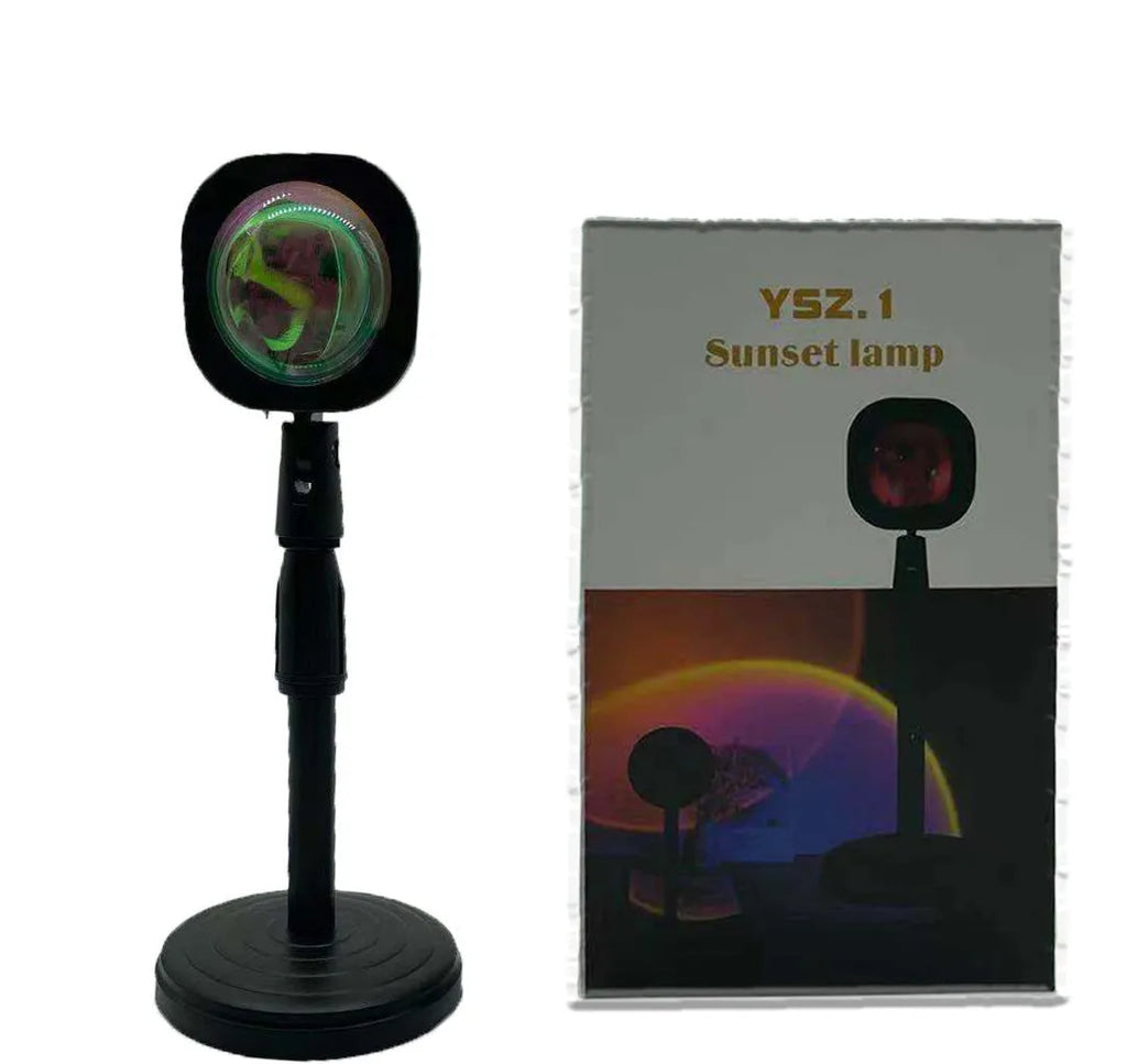 Rechargeable sunset projection lamp showing rainbow colour effects with USB cable