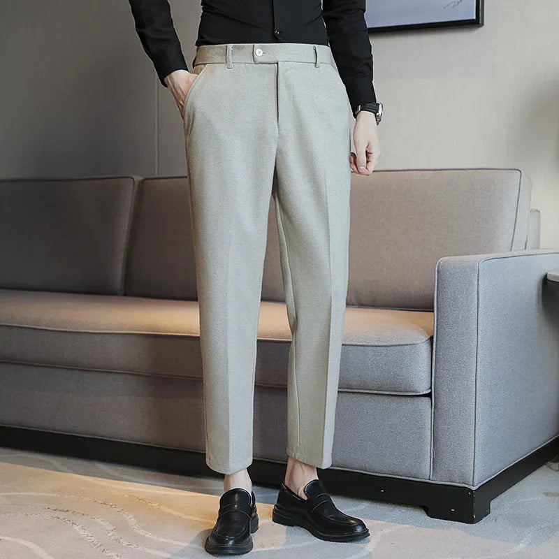 Brown straight leg corduroy trousers with elastic waistband on hanger