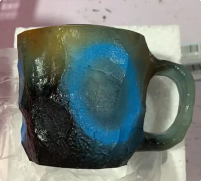 Resin mineral crystal coffee mug with handle in purple colour showing transparent construction