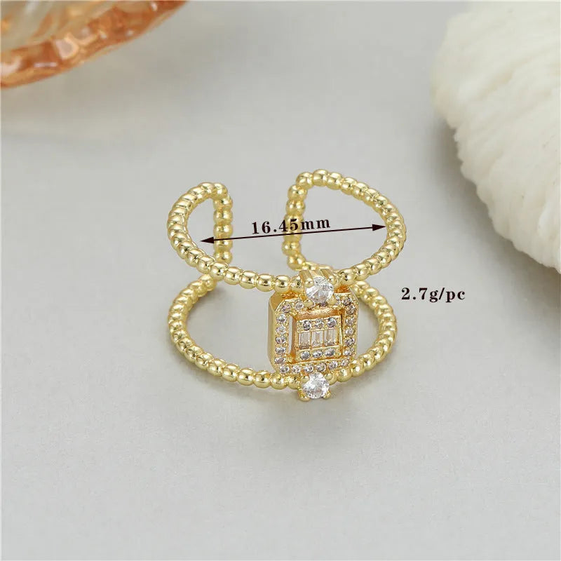 Copper-plated gold open ring with adjustable opening and asymmetric U-shaped design.