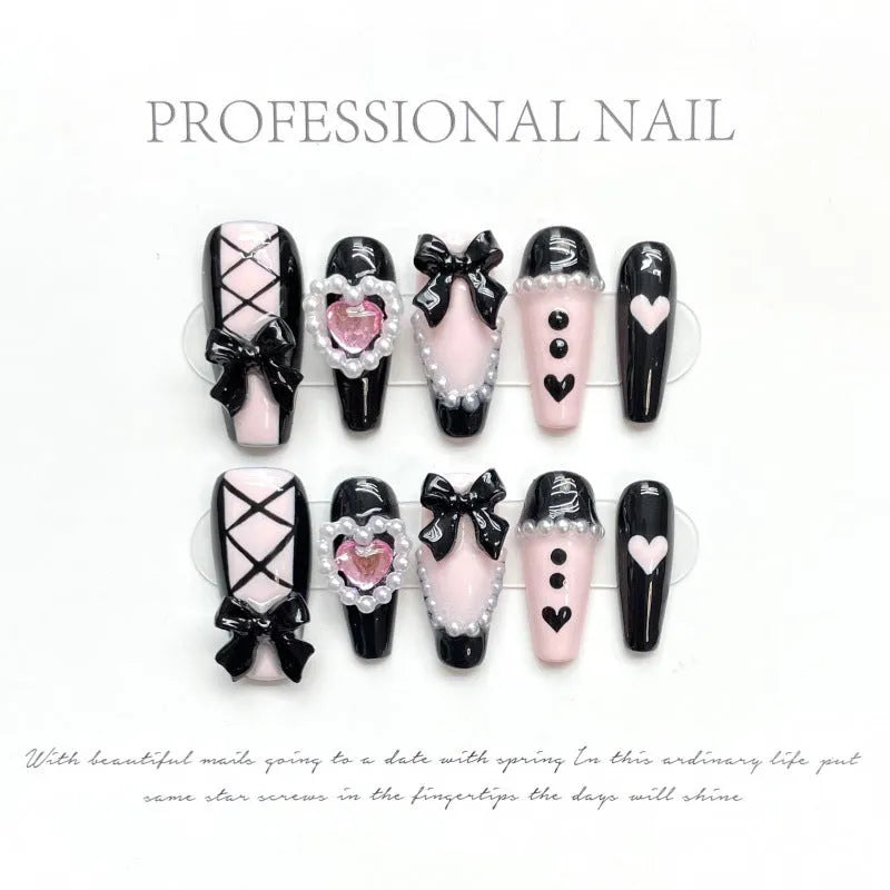 Black peach heart hand-painted false nails with cat's eye style and bow patterns