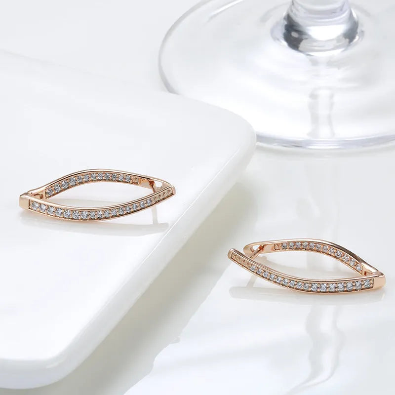 Geometric-shaped copper drop earrings for women with zircon stones, shown as a pair.