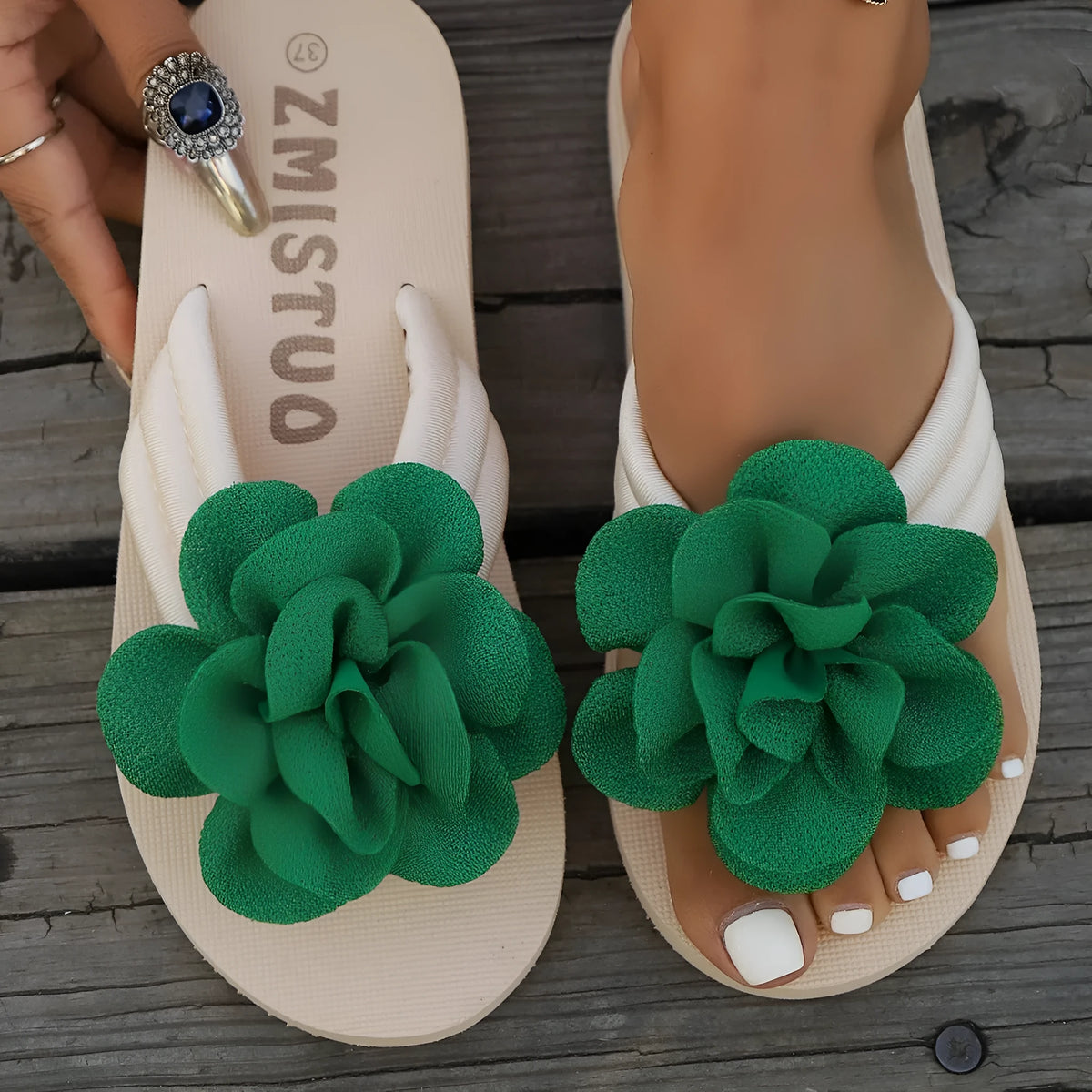 Women's plus size floral flip flop slippers in solid green colour, showing round toe shape