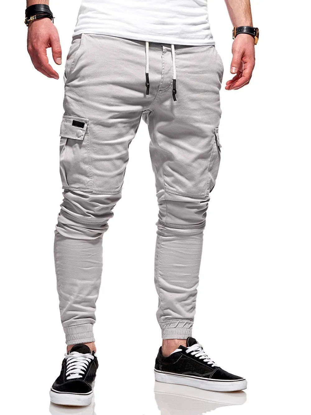 Men's loose fit polyester trousers with patch pockets and elastic waistband in light blue colour