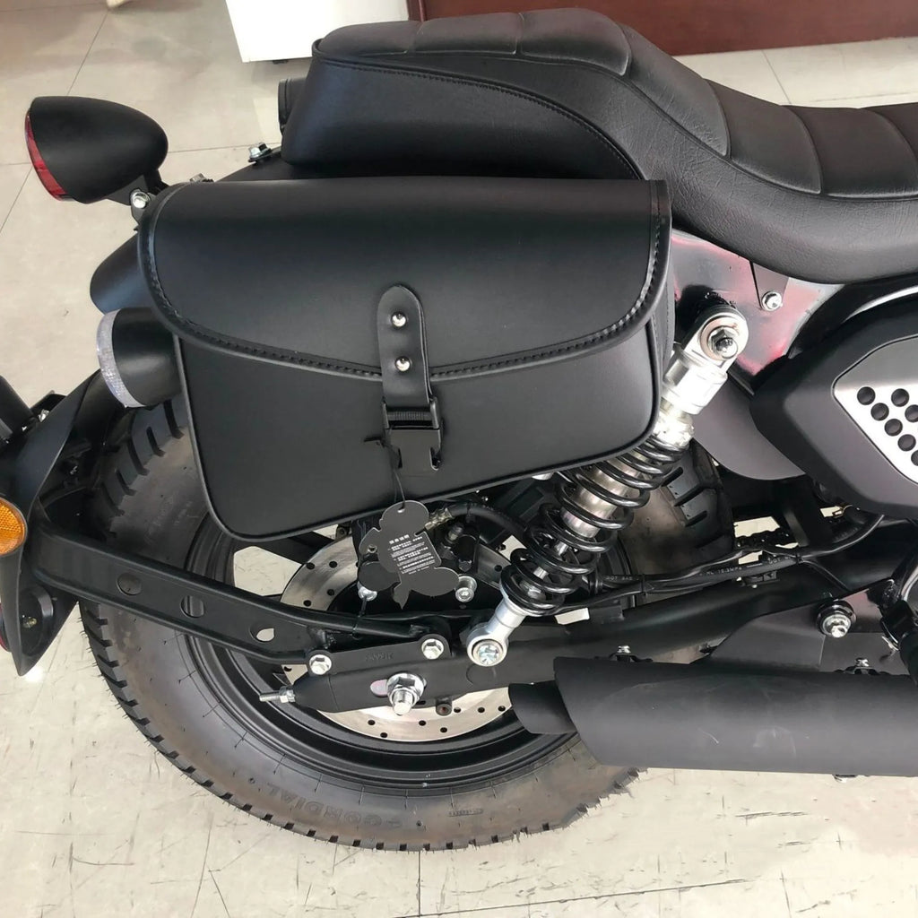 Black PU leather motorcycle swingarm side saddlebag mounted on a Harley-Davidson Sportster.