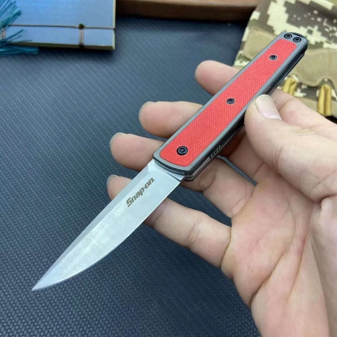 CRKT 7190 folding fruit knife showing blade and handle with colour options of black, brown, and red