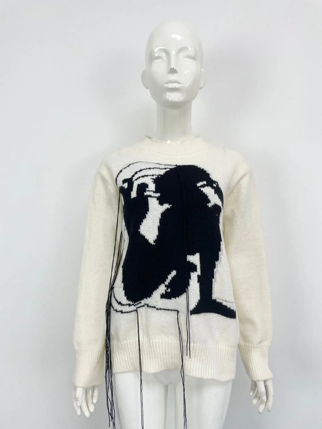 Women's grey alpaca wool sweater with abstract pattern and tassel design on front