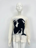 Women's grey alpaca wool sweater with abstract pattern and tassel design on front