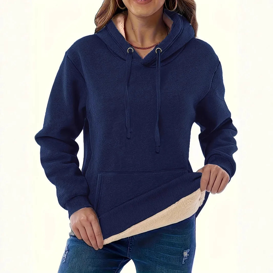Women's loose fit grey hooded sweatshirt with a 3D textured pattern and a front pocket.