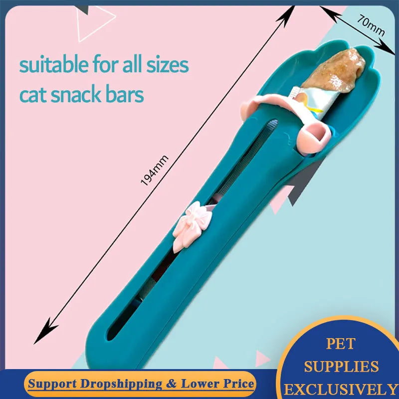 Green and pink pet feed spoon with integrated treat extrusion tool and liquid food squeezer feeder