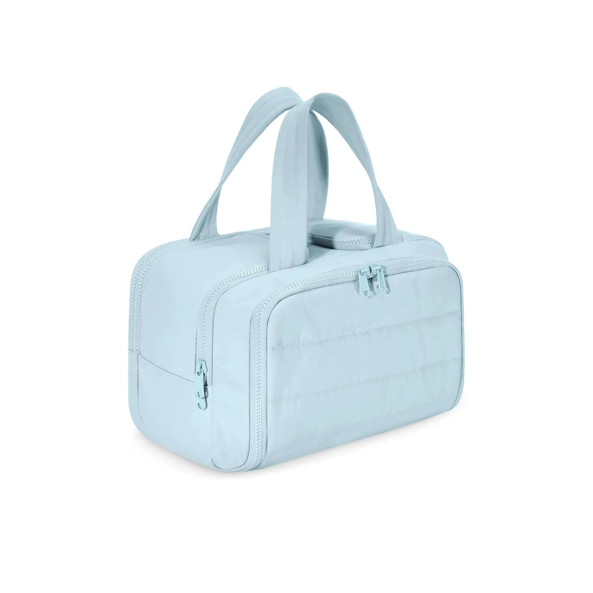 Large fluffy travel toiletry bag open wide showing soft interior, available in beige, black, light blue, pink, purple, and creamy-white.