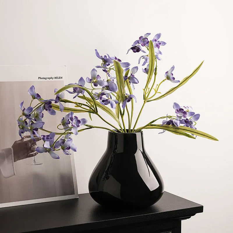 Ceramic decorative vase with glass surface in black or white colour with round belly French design