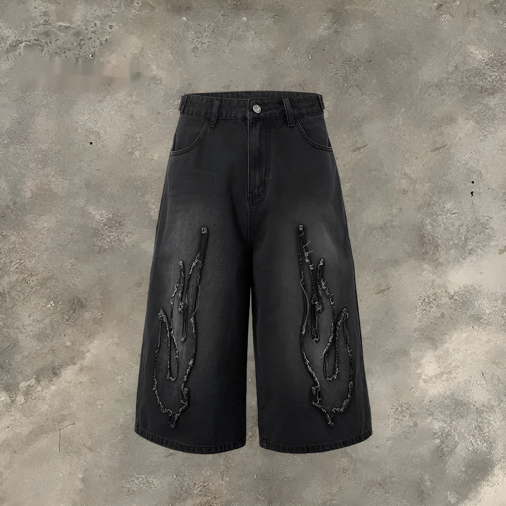 Men's black denim shorts with flame embroidery patch and cropped length for summer streetwear