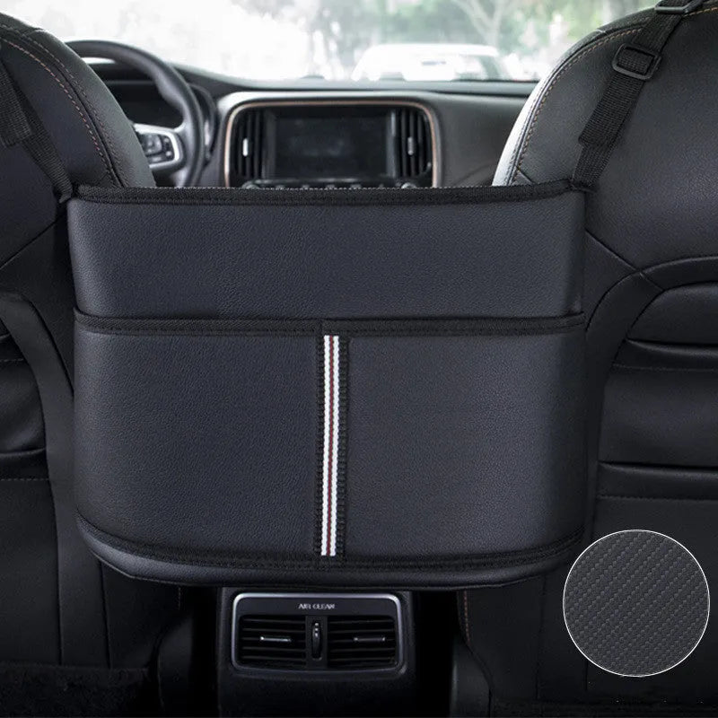 Black leather car seat net pocket storage bag with sports carbon fibre pattern placed between vehicle seats