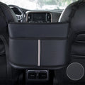 Black leather car seat net pocket storage bag with sports carbon fibre pattern placed between vehicle seats