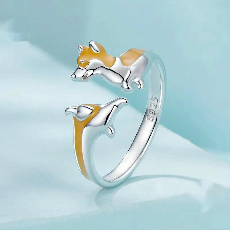 Silver ring with a raised cartoon corgi design in colour SCR1014-E.