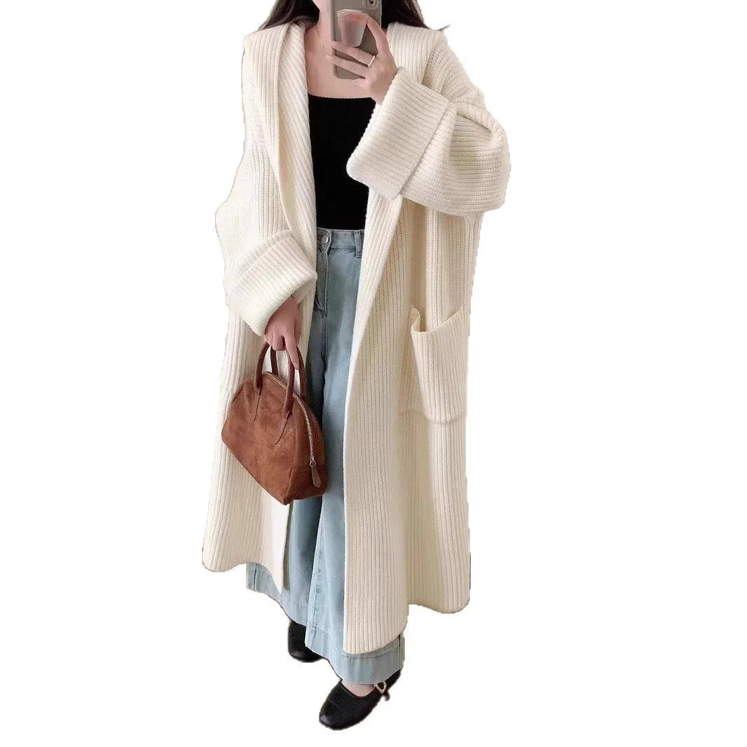 Women's loose grey hooded cardigan coat with raglan sleeves on hanger