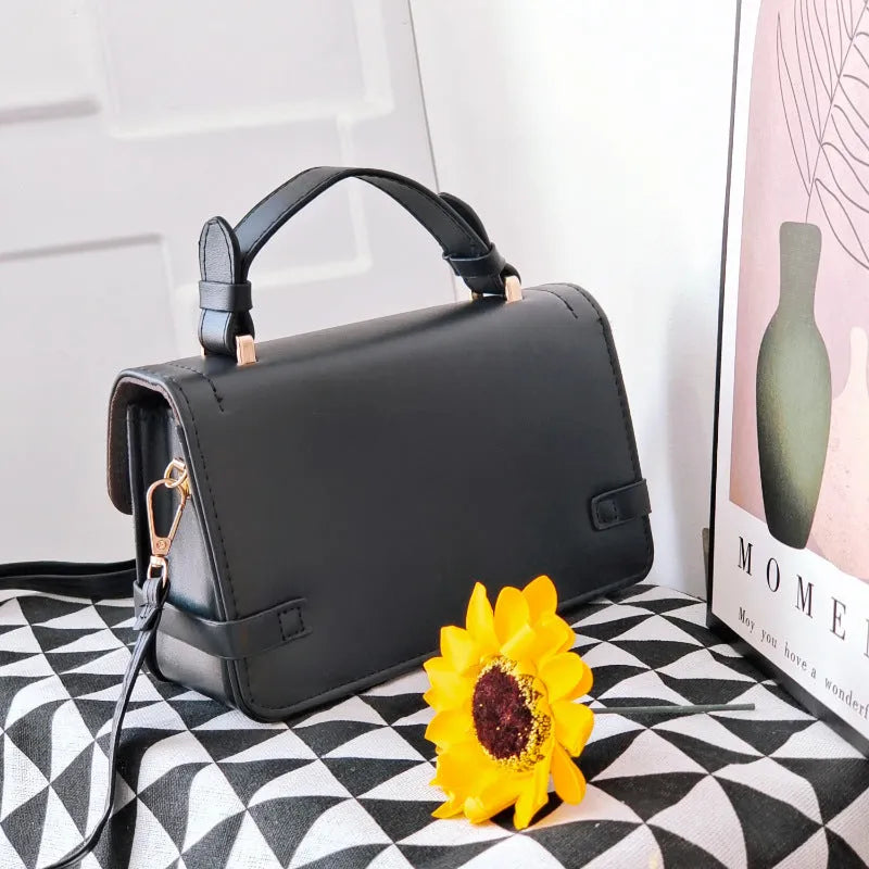 PU leather crossbody bag with small square ethnic pattern design showing file bag interior organisation