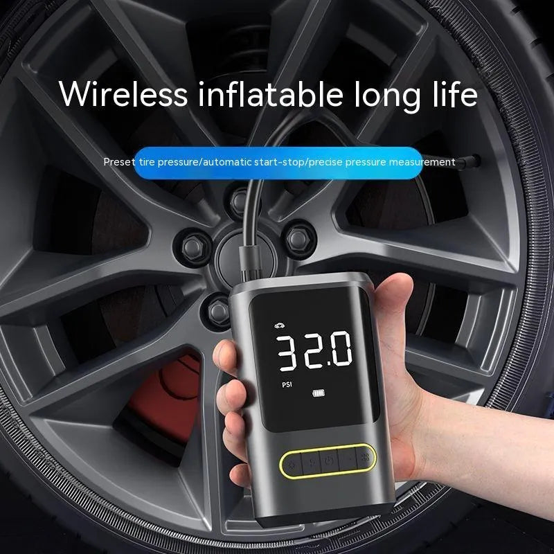 Black handheld wireless digital tyre inflator with LED display and flexible hose on a grey background.