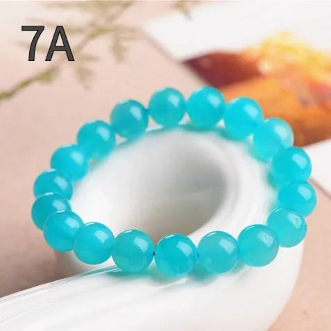 Grade 7A Amazonite natural gemstone scattered beads showing blue-green ice colouration and polished surface