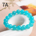 Grade 7A Amazonite natural gemstone scattered beads showing blue-green ice colouration and polished surface