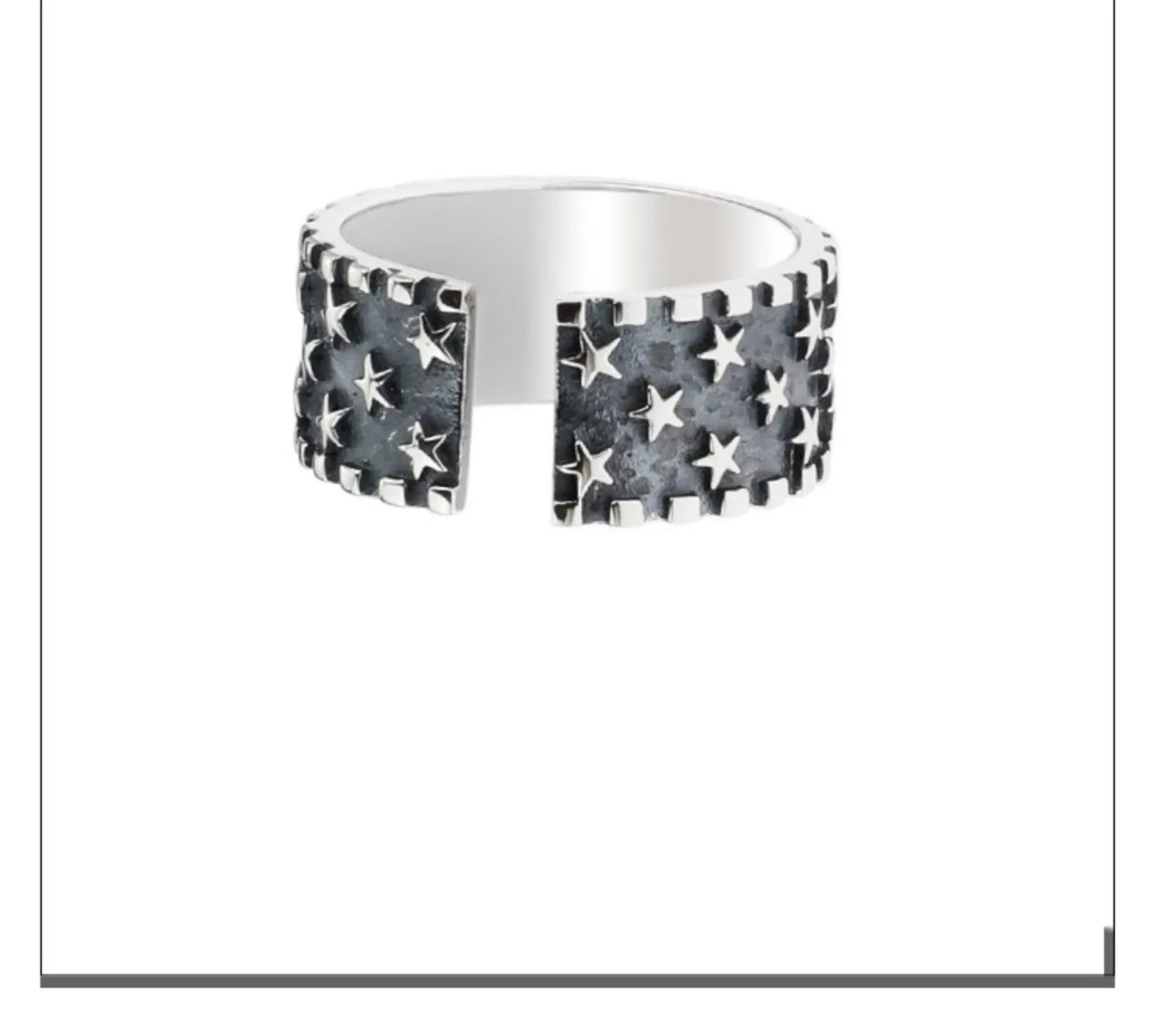 Adjustable open-ended sterling silver ring with a five-pointed star design.
