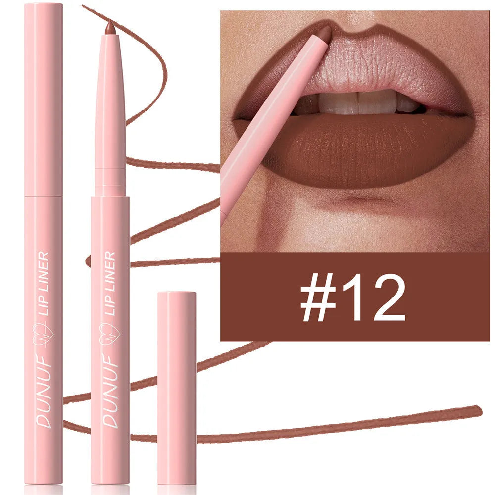 Set of twelve velvet matte lip liner pencils in a range of colours on a white background.