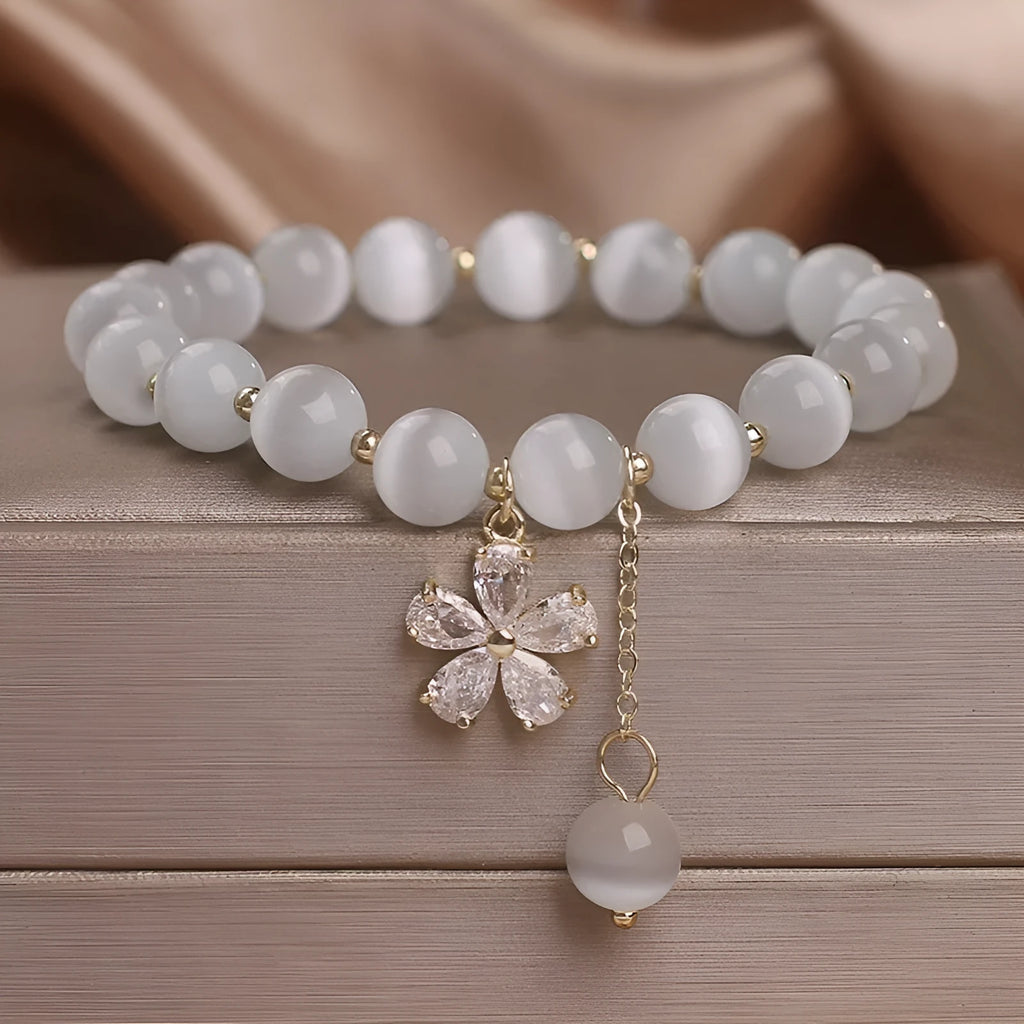 Women's white cat's eye crystal bracelet with flower tassels and safety buckle