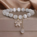 Women's white cat's eye crystal bracelet with flower tassels and safety buckle