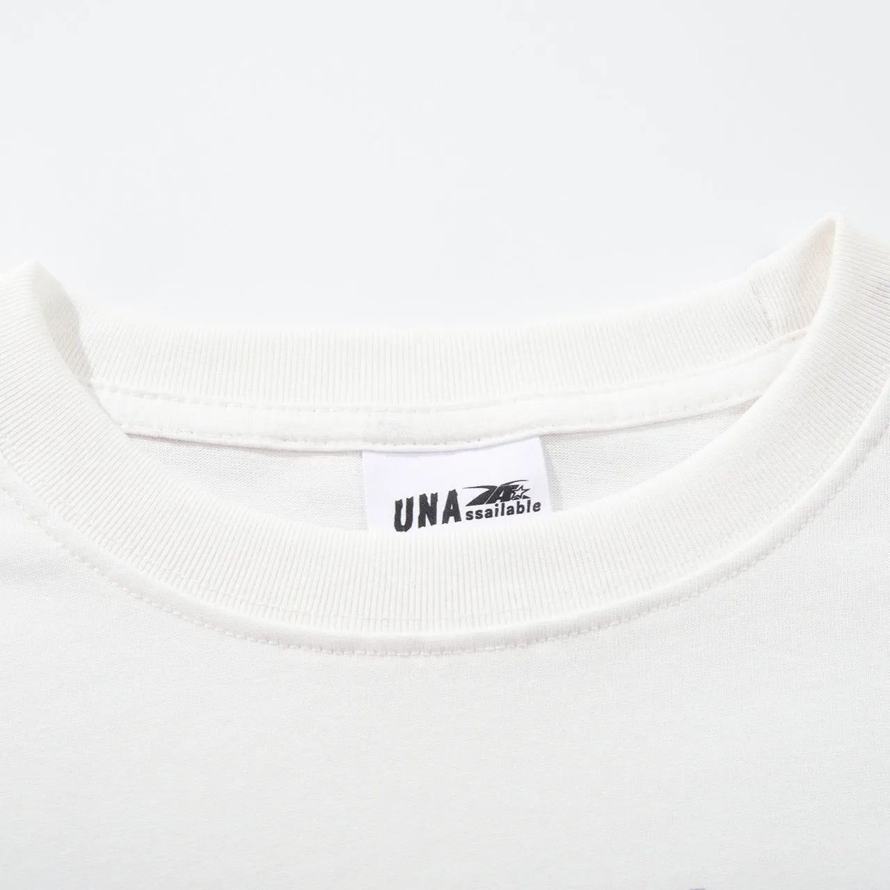 Men's white cotton t-shirt with retro design print showing loose fit and short sleeves