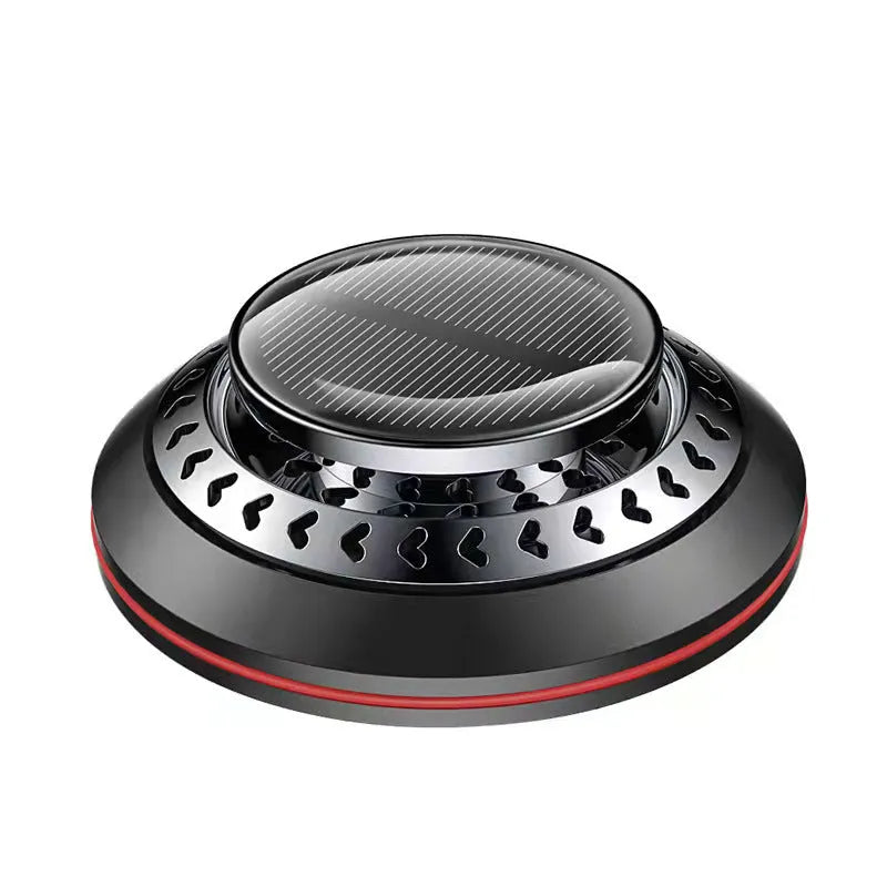 Compact black solar-powered aluminium alloy car air freshener for odour removal on a car dashboard