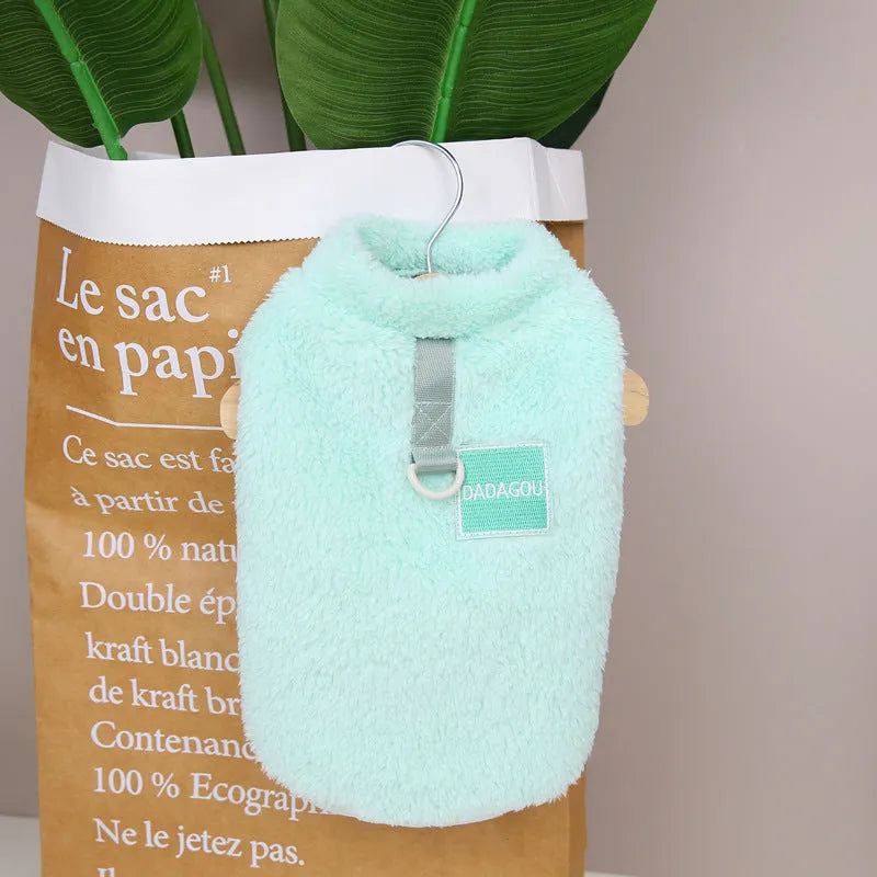 A blue coral fleece pet jacket for dogs or cats fastened with multicoloured pull rings.
