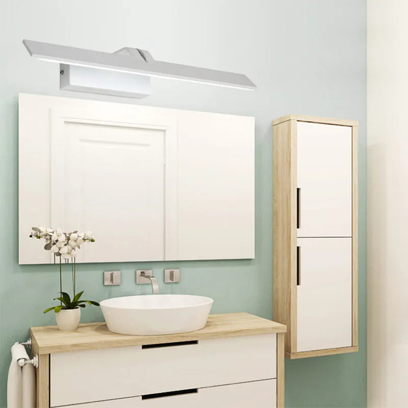 A white rectangular LED bathroom wall mirror with integrated dimmable tri-colour lighting, shown at 580mm long.
