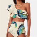 White women's one-shoulder swimsuit with large lotus leaf detail and split-leg design