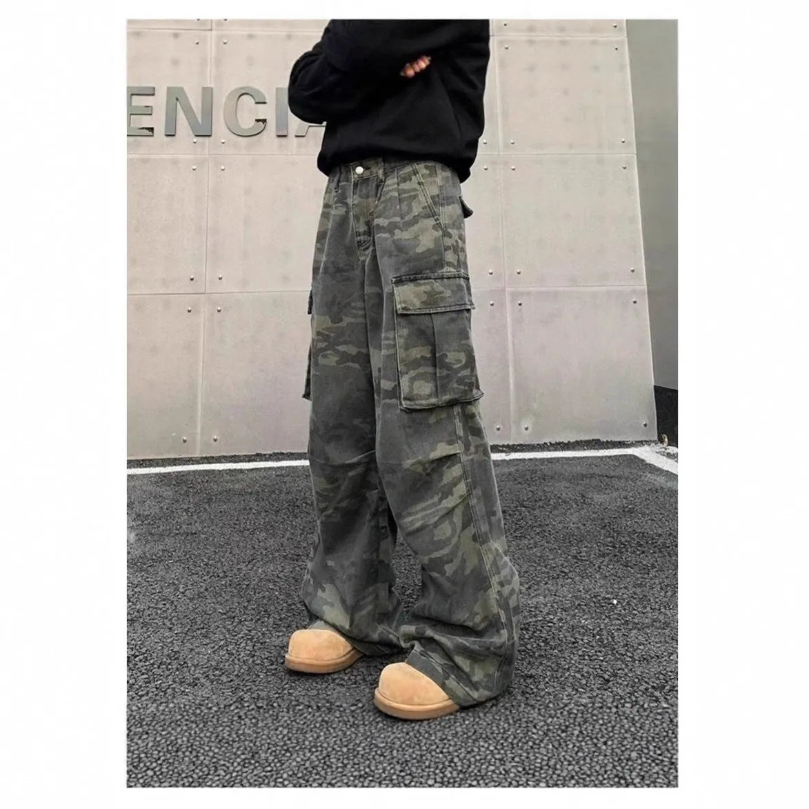 American vintage washed camouflage green cargo trousers with multiple pockets on a neutral background.