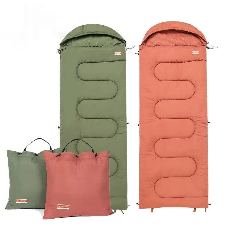 Cotton camping sleeping bag quilt in ochre colour laid out flat for outdoor use