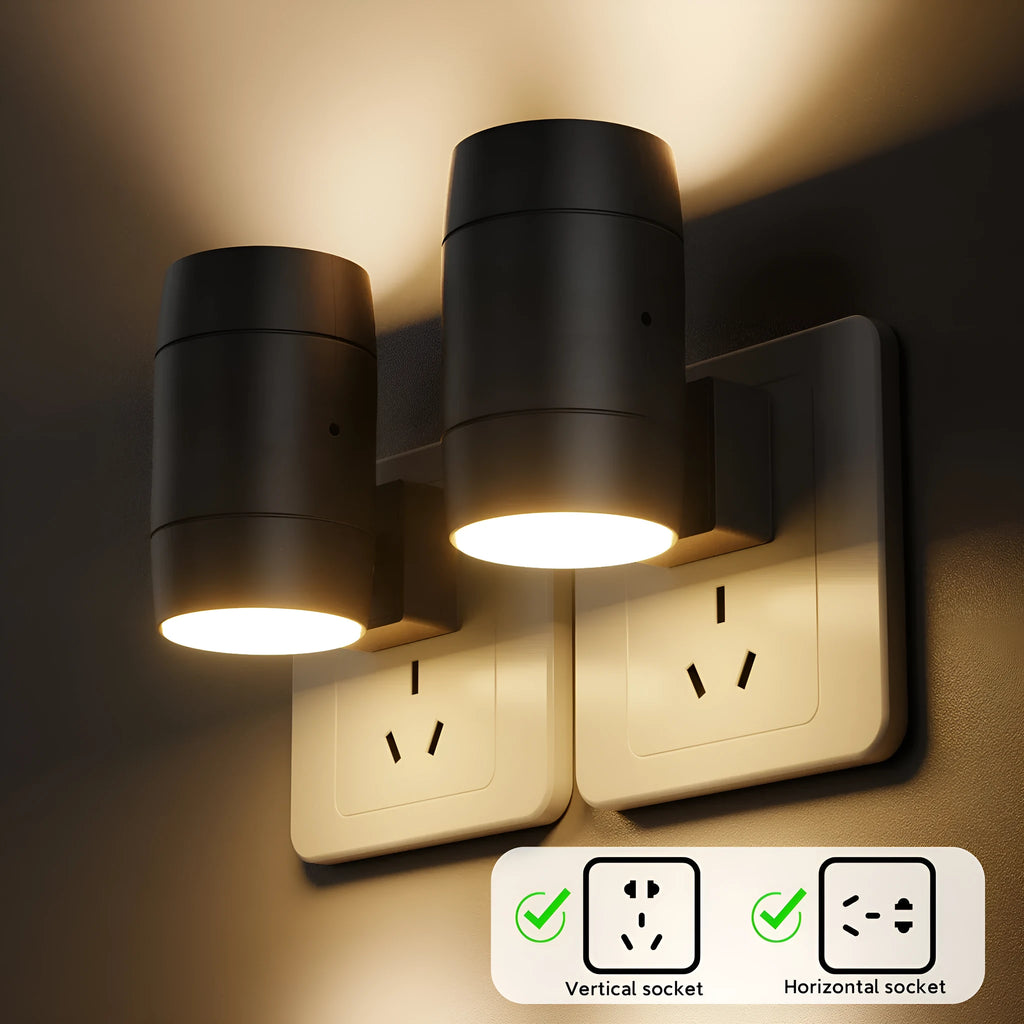 Small white plug-in night lamp with a rotatable light head on a bedside table.