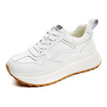 Beige women's cattlehide leather low-top sports shoes with an English muffin heel and cross strap detail