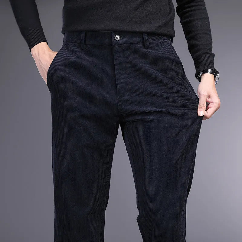 British retro striped straight-leg men's trousers in khaki colour on a hanger.