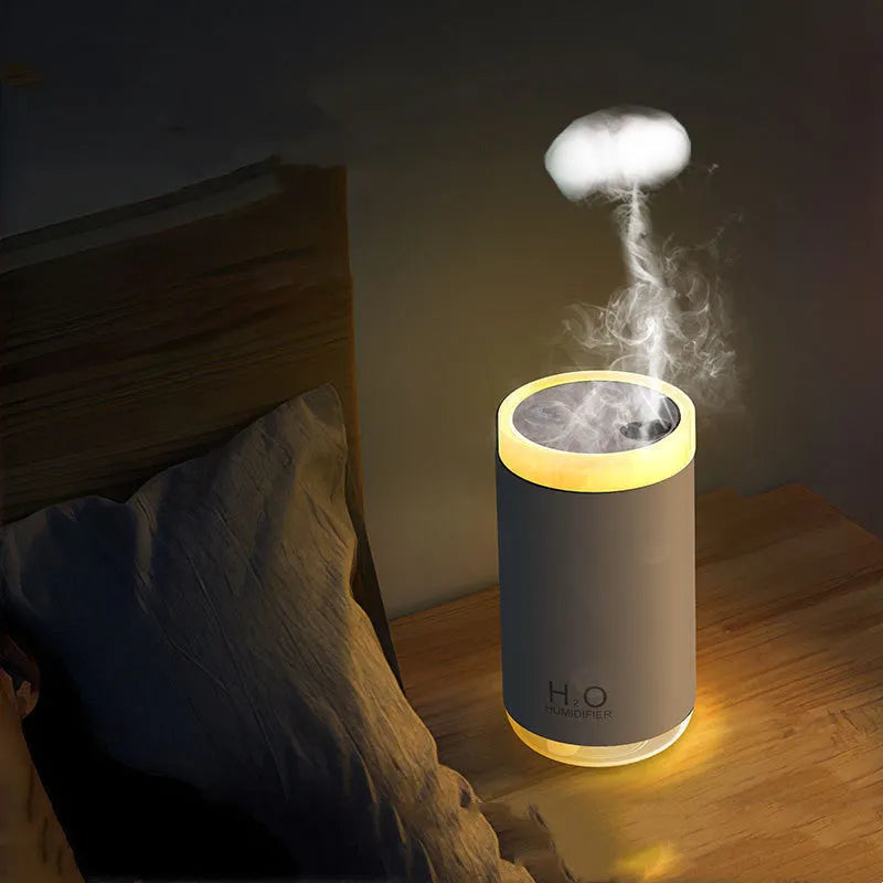 White USB jellyfish humidifier with warm night light on a table