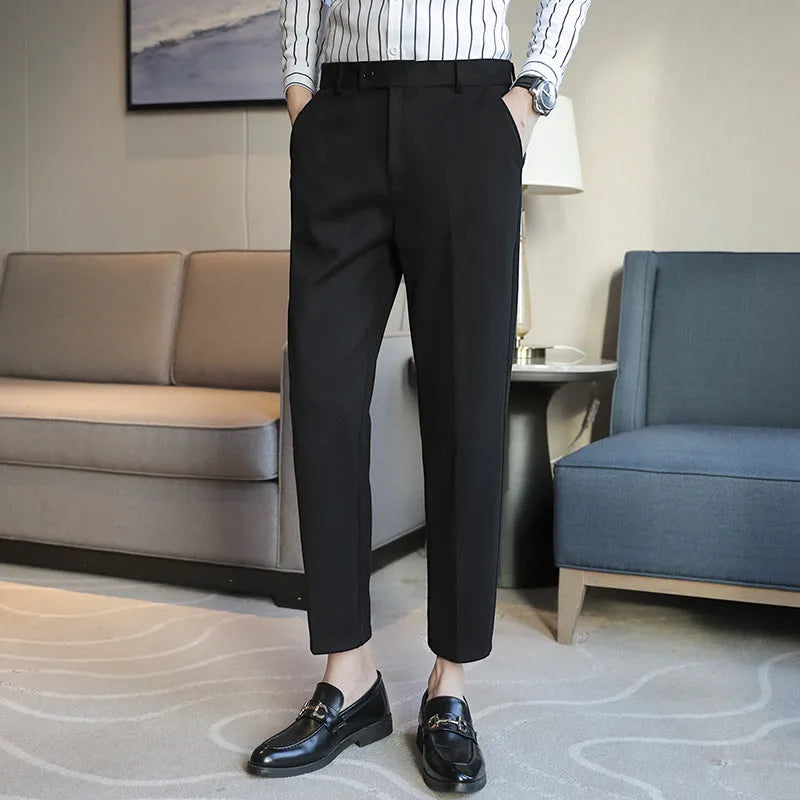 Brown straight leg corduroy trousers with elastic waistband on hanger