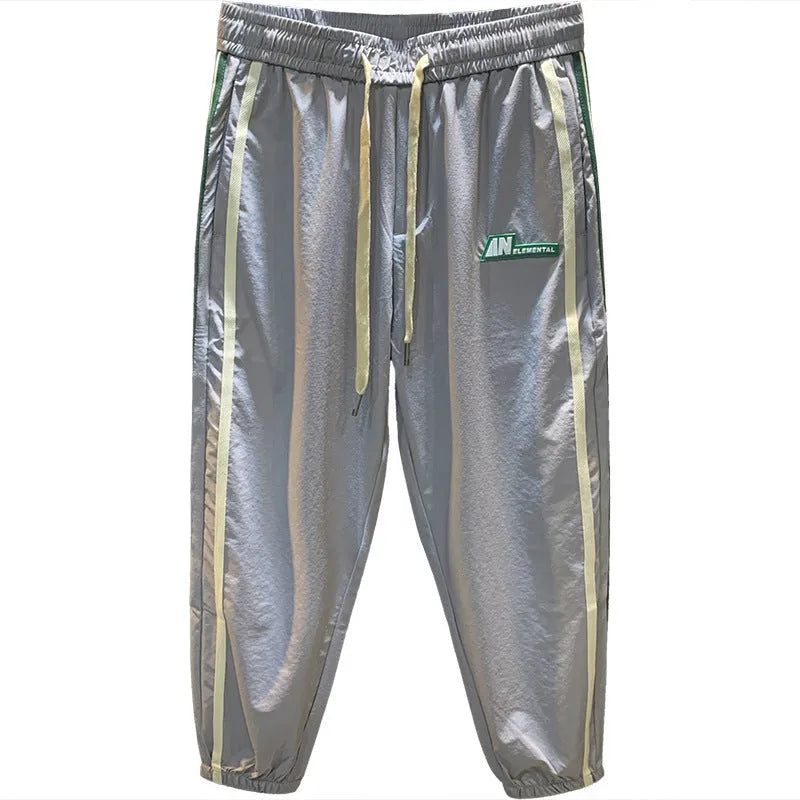 Men's black cotton harem pants showing mid waist and loose fit