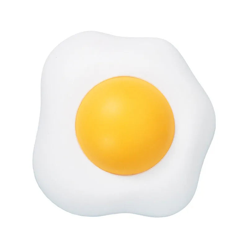 Interactive catnip ball toy with adhesive backing for walls, available in fried egg and poached egg designs