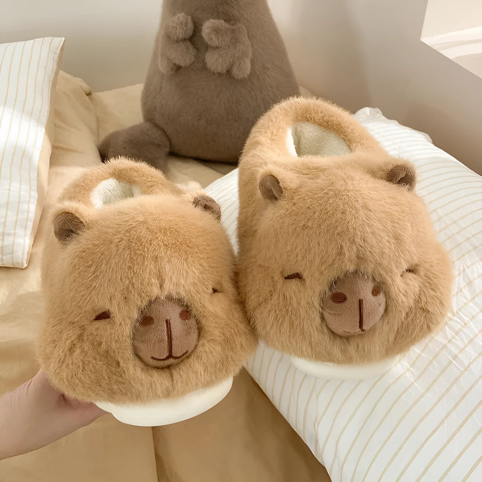 Light brown women's winter slippers with cartoon pattern, plush upper, and round toe.